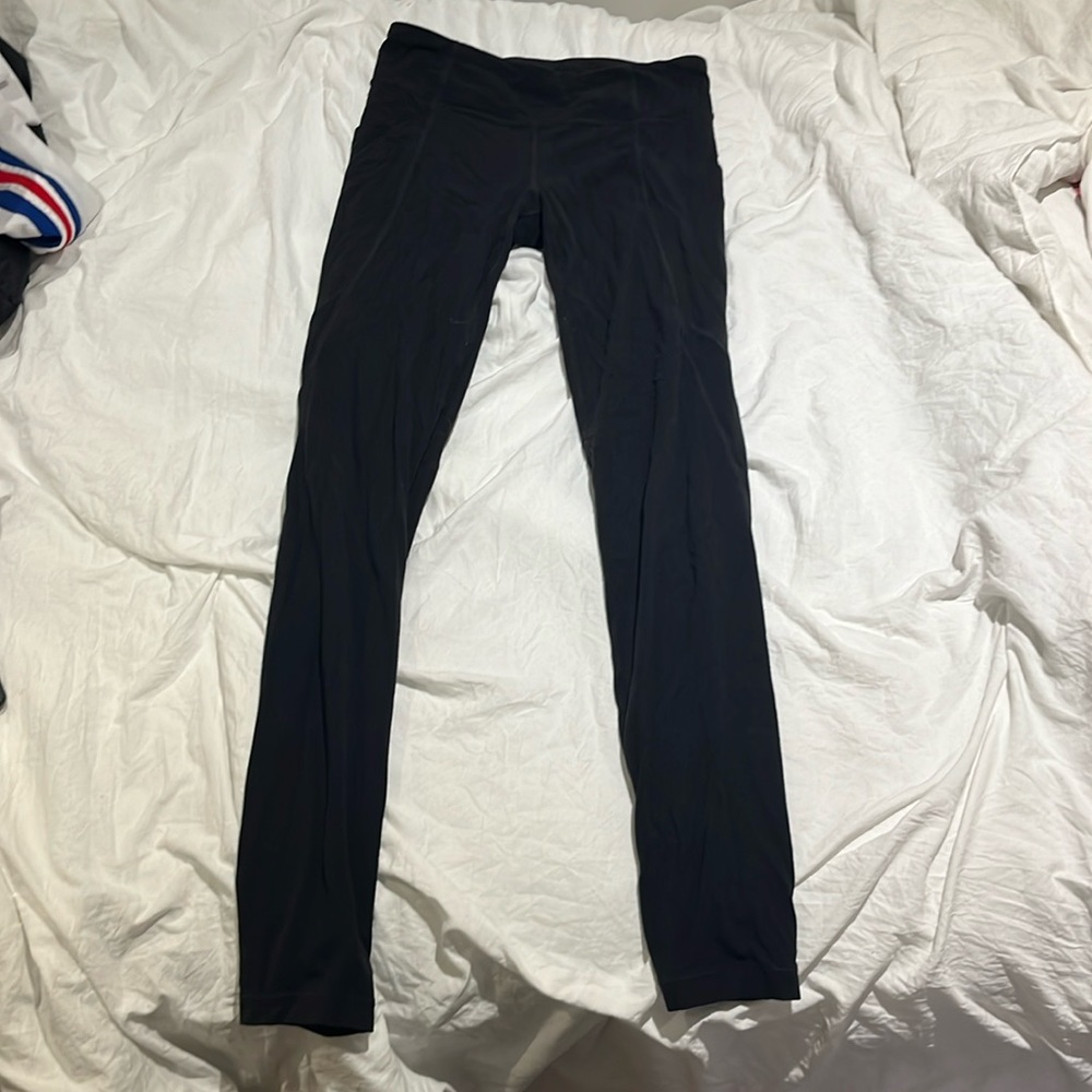 Athleta Girls black leggings size XL/14 with pockets on the side and waste tie